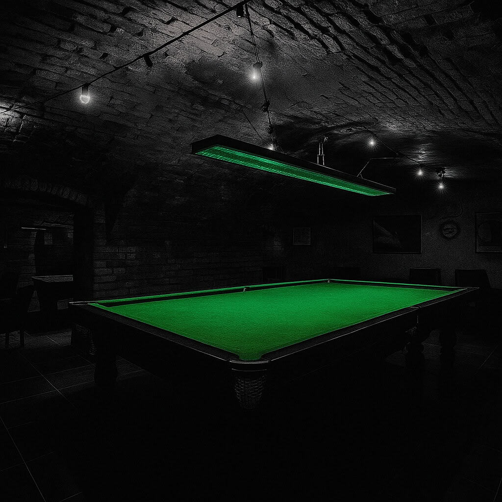 Interior of Füge Udvar ruin bar in Budapest, featuring a green-lit snooker table under brick vaults, with dark shadows and a moody atmosphere.