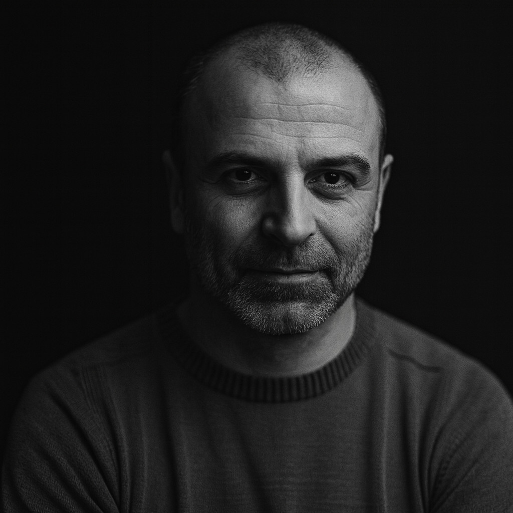 Black-and-white cinematic portrait used to represent Attila Gyurkovics, the Hungarian creator of the world’s first escape room concept.